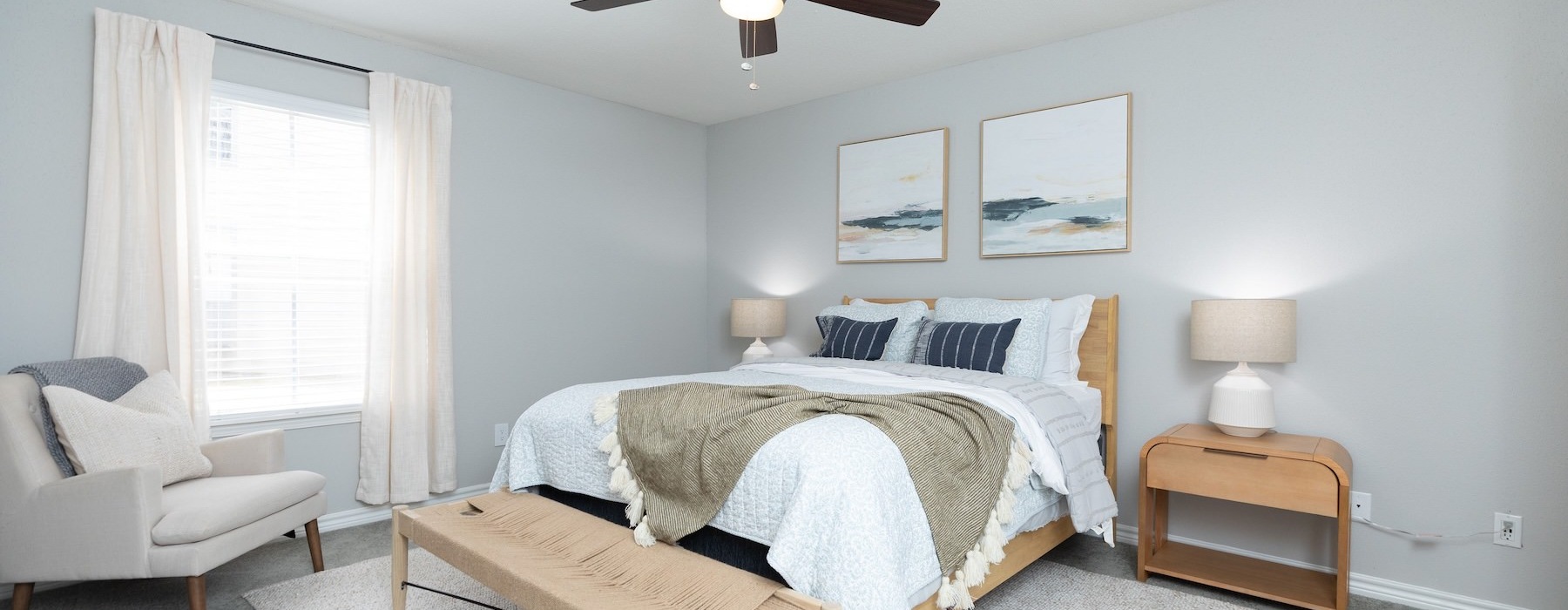 a bedroom with a bed and a bench