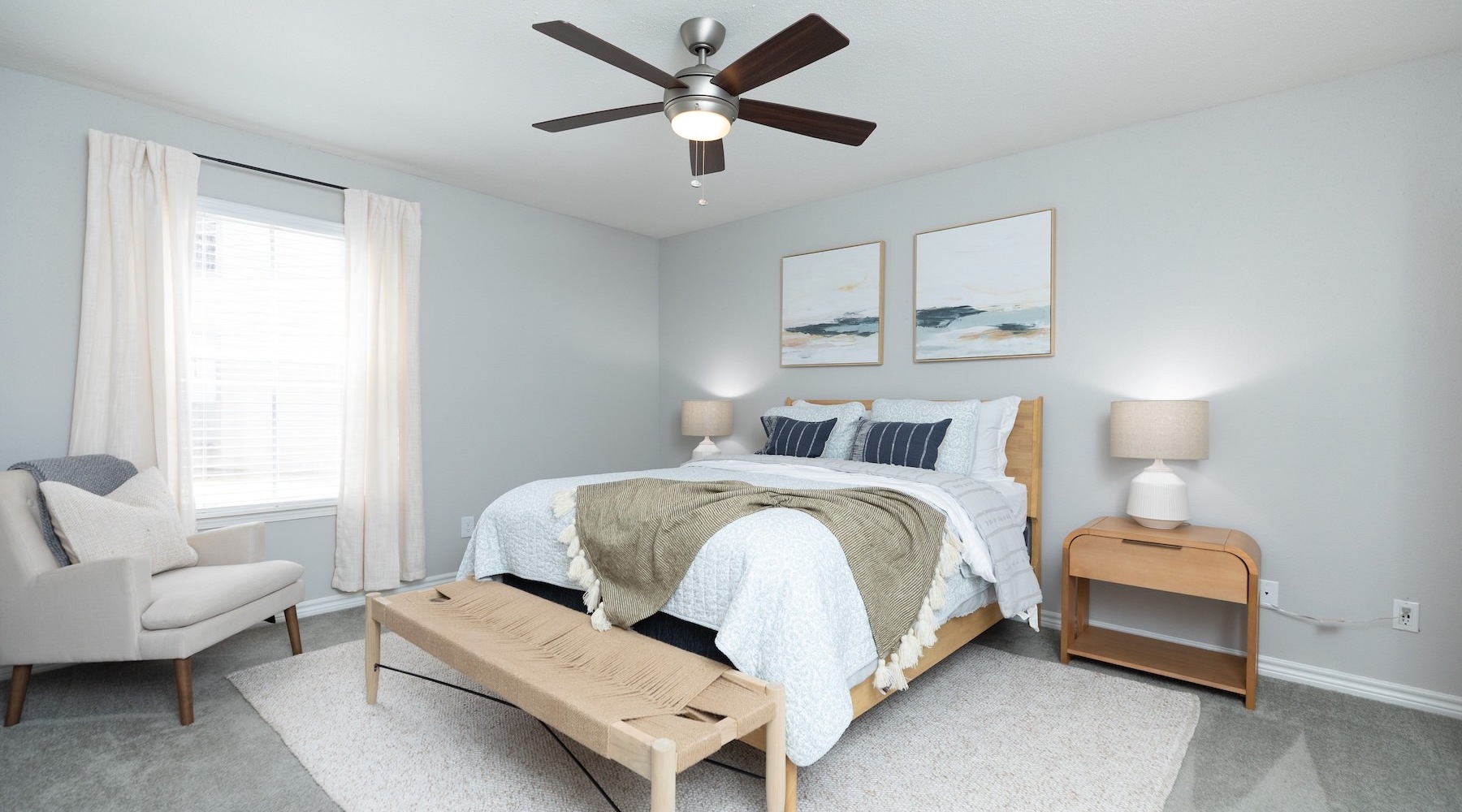 Beautiful bedrooms to fit every need a bedroom with a bed, chair, nightstand and a wooden bench