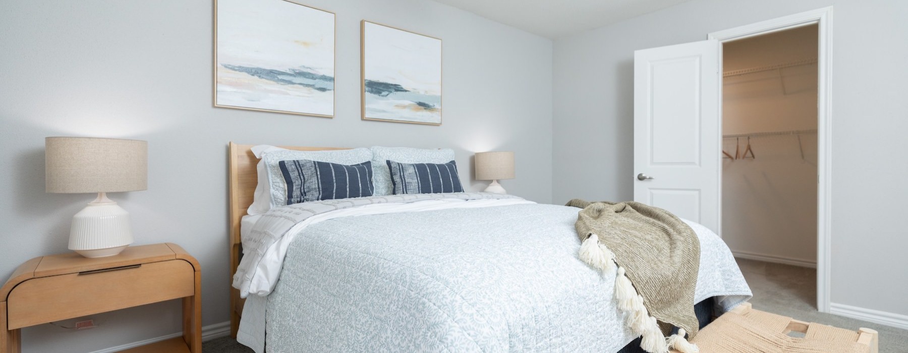 a bedroom with a bed and a fan