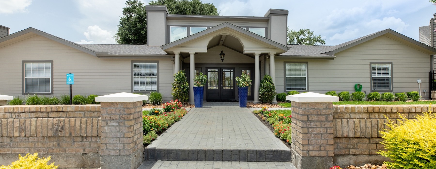 a building with a stone walkway