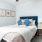 a bedroom with a bed and a fan