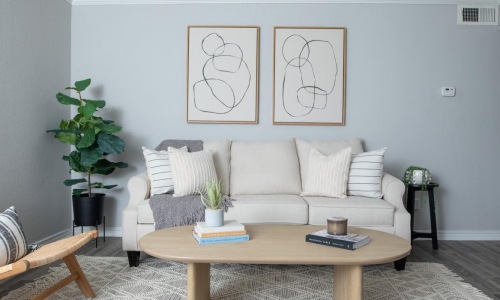 a living room with a couch and coffee table