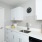 a kitchen with white cabinets