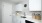 a kitchen with white cabinets