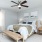 a bedroom with a bed and a bench