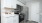 a kitchen with white cabinets