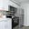 a kitchen with white cabinets