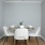 a dining room with a table and chairs
