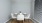 a dining room with a table and chairs