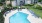 a pool with chairs around it