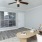 a living room with a table and chairs
