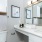 a bathroom with a mirror and sink